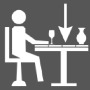 Ikon - mand der sidder ved et bord